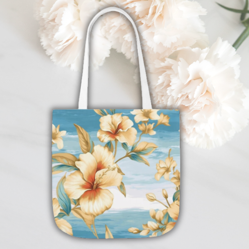 Our Tropical Bloom Beach Tote – a stylish blend of 100% Polyester canvas, showcasing vibrant yellow flowers on a water background. Choose from 3 sizes.
