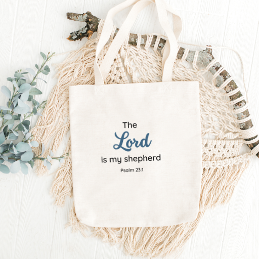 Discover our faith-inspired 'Psalm 23:1' Tote Bag, a stylish eco-friendly accessory with inspiring scripture. Available in 3 sizes and 5 strap colors. Replace plastic bags with purpose."