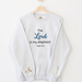 Sweatshirt that says the Lord is my shepherd. Psalm 23:1 and features sheep on one sleeve and a shepherd on the other. Available in a variety of colors and sizes.