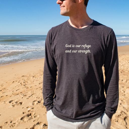 Long sleeve tee that says "God is our refuge" on the front and "a very present help. Psalm 46:1" on the back